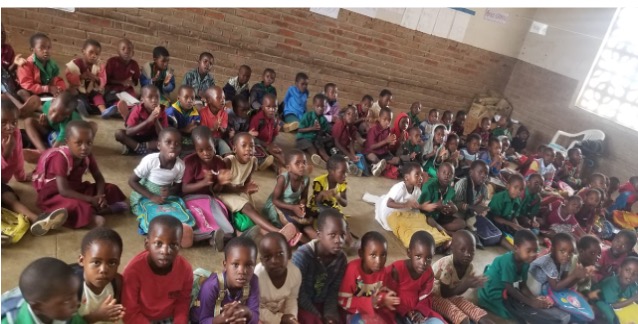 Students in Malawi learning in and overcrowded Classroon